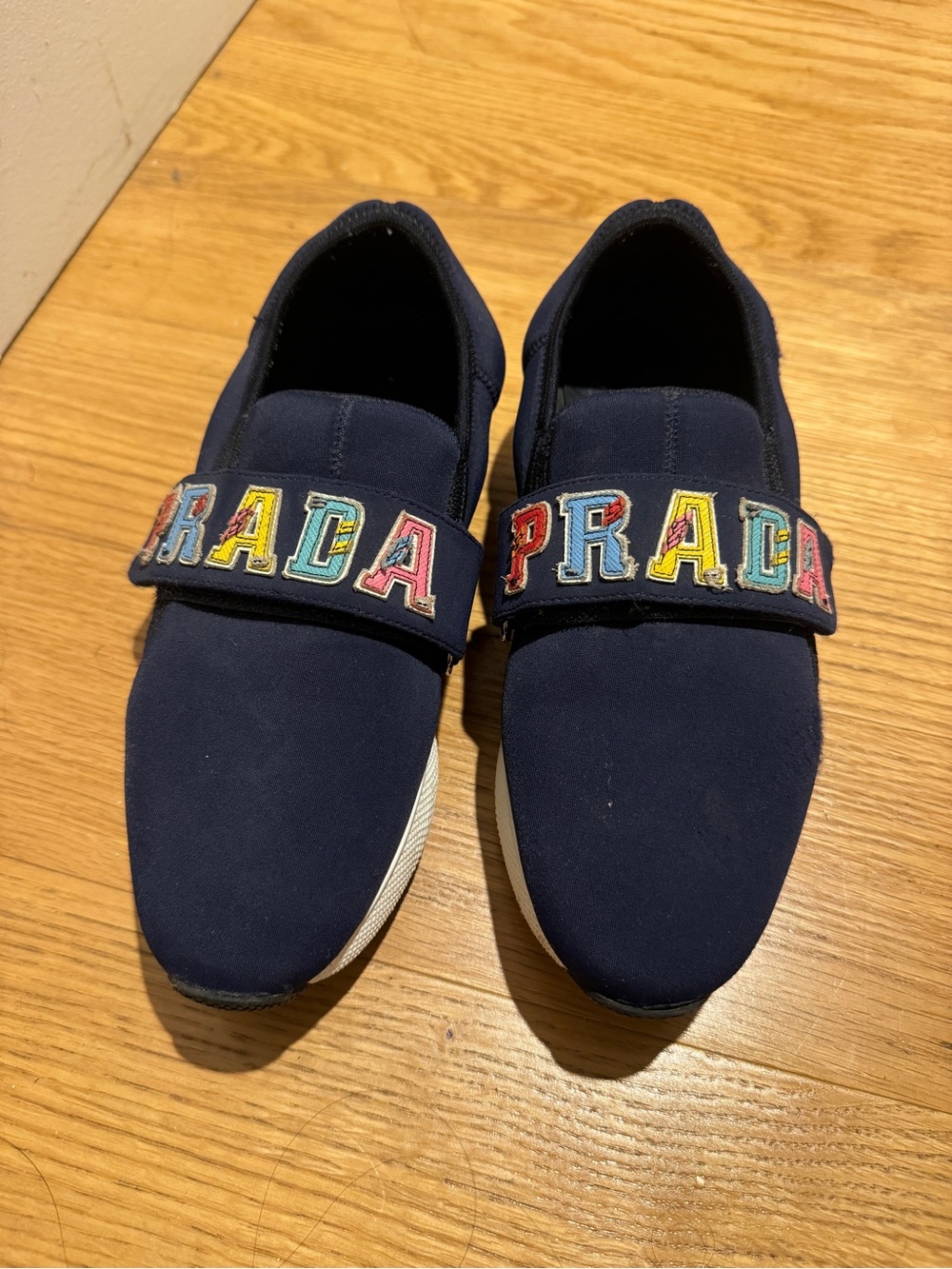 Prada Navy Neoprene Slip-On Sneakers with Multicolor Logo Strap